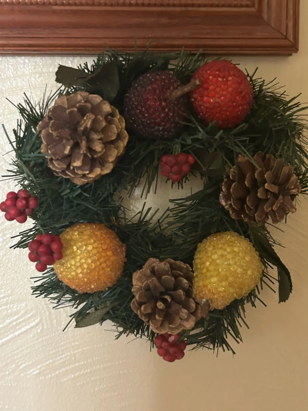 VTG artificial wreath/candle ring w/faux fruit, pinecones, and red berries.